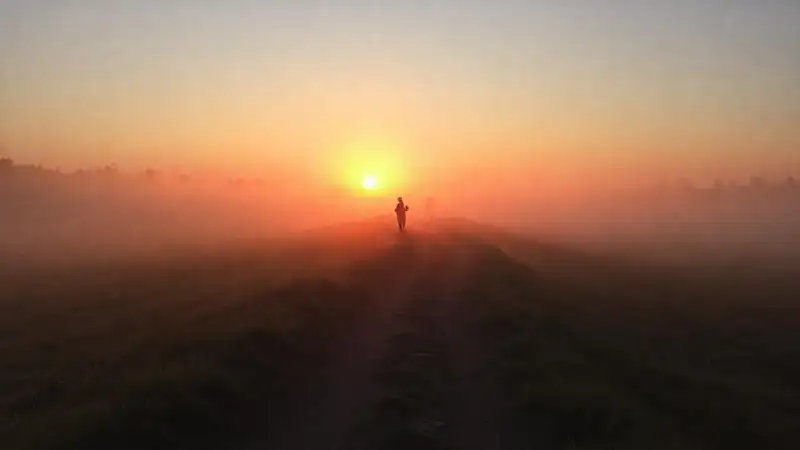 A hopeful figure starts a journey